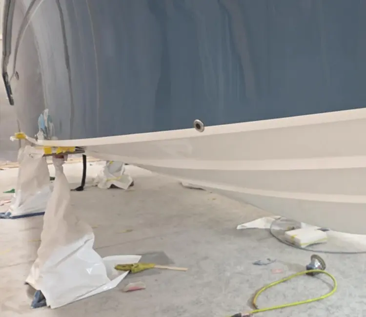 Fresh hull paint during boat painting and refinishing in Vermont