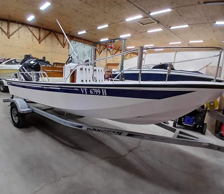 Boat painting and refinishing in Vermont, boat staged inside the shop