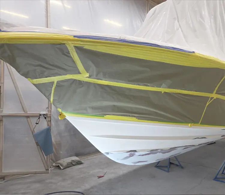 Boat hull repair in Vermont with masking and prep work before final finishing
